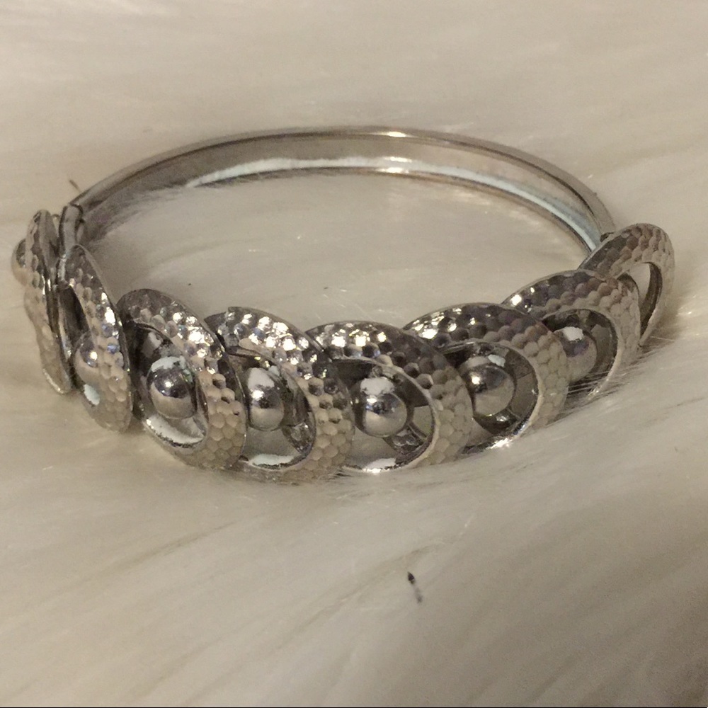Silver tone hinged bracelet